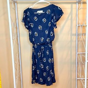 Blue XS dress from Loft with floral design, tie belt, and ruffles on sleeves.